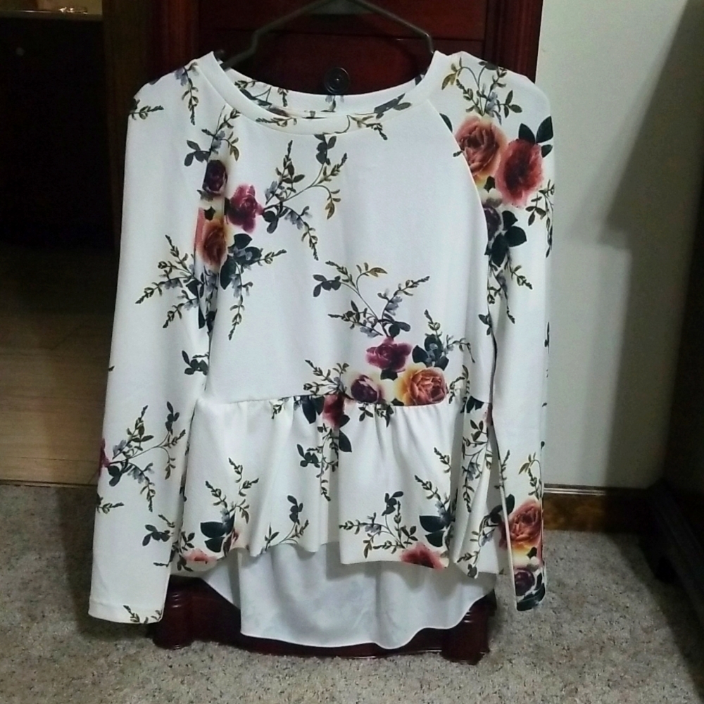 Long sleeve small white with floral print woman's blouse.